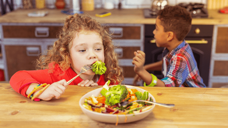 "High-protein tiffin box for Indian kids with roti, paneer, boiled eggs, and fruits—a perfect protein-rich food for Indian kids."